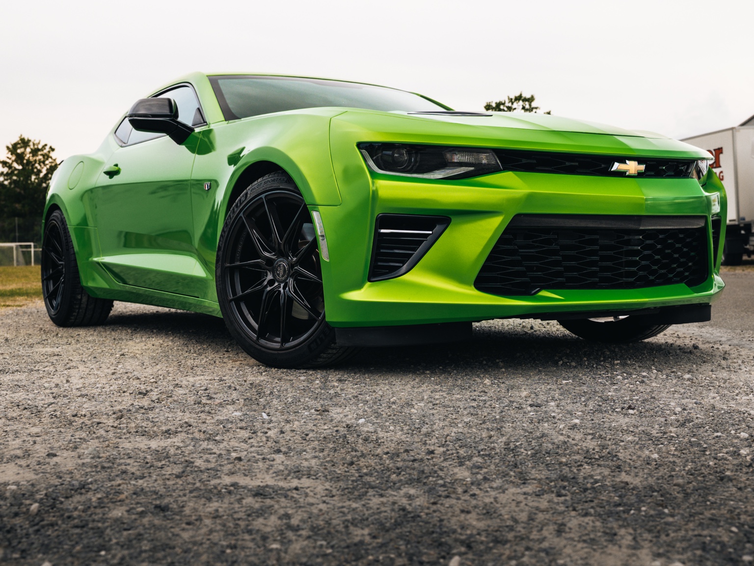 Green Chevrolet Camaro photographed from a low angle