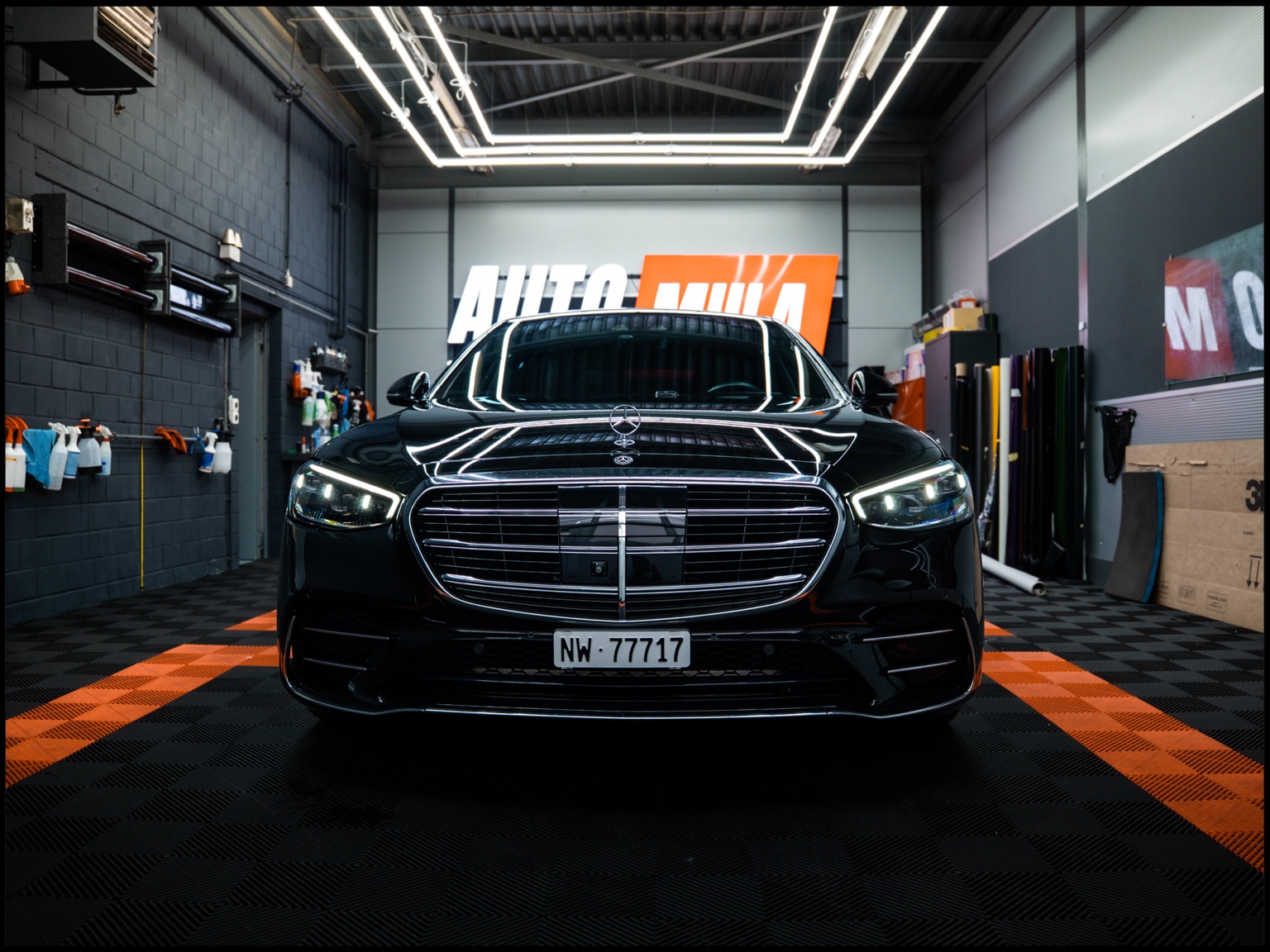 Black Mercedes in a detailing studio