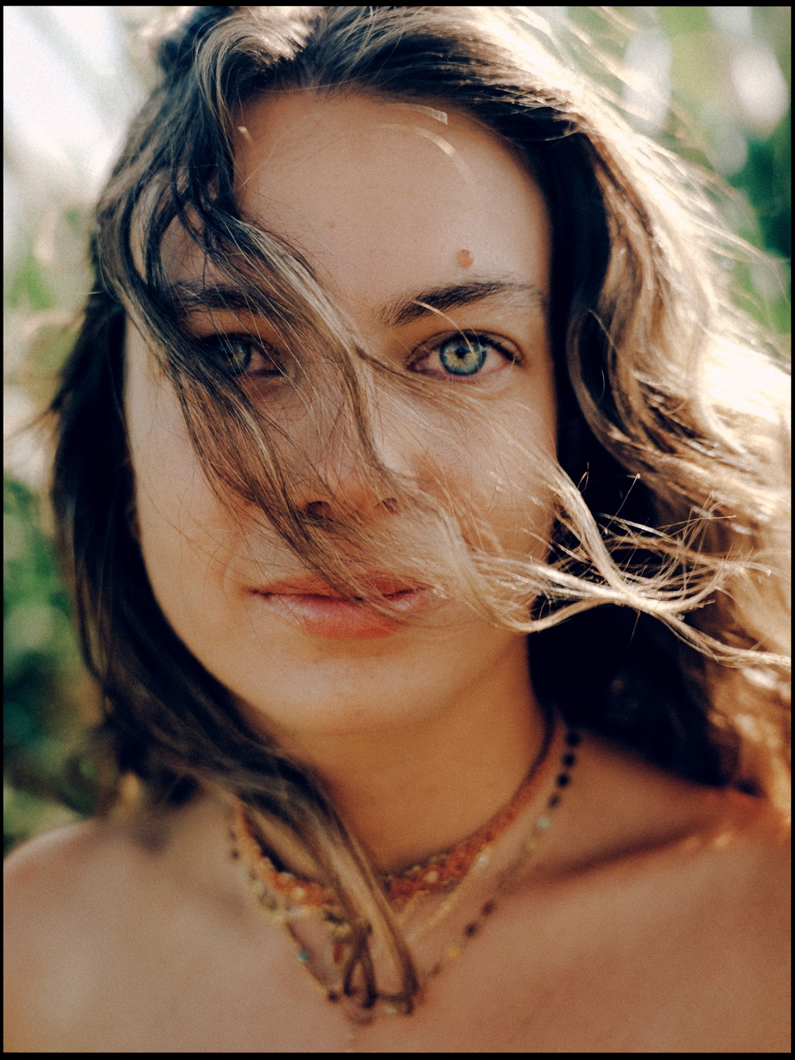 Close portrait with hair in motion